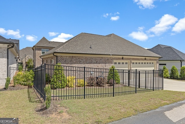2824 Cork St, Braselton, GA 30517 - view of front of home with brick siding, a garage, driveway, and a shingled roof