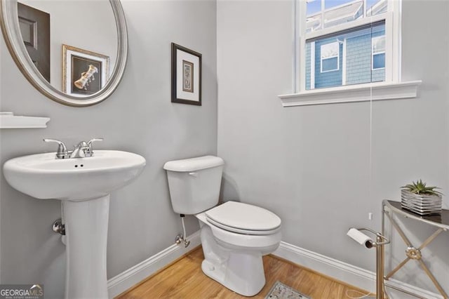 1365 Memorial Dr SE Unit # 12, Atlanta, GA 30317 - half bath with baseboards, wood finished floors, toilet, and a sink