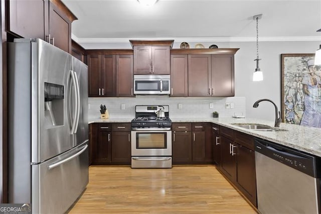 1365 Memorial Dr SE Unit # 12, Atlanta, GA 30317 - kitchen with stainless steel appliances, a sink, crown molding, decorative backsplash, and light stone countertops