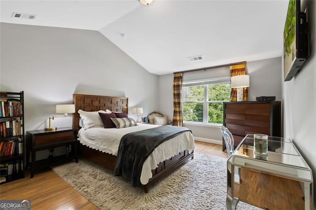 1365 Memorial Dr SE Unit # 12, Atlanta, GA 30317 - bedroom with vaulted ceiling and wood finished floors