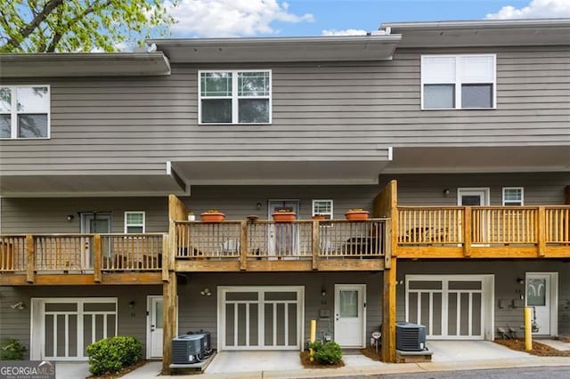 1365 Memorial Dr SE Unit # 12, Atlanta, GA 30317 - back of property featuring a garage and cooling unit