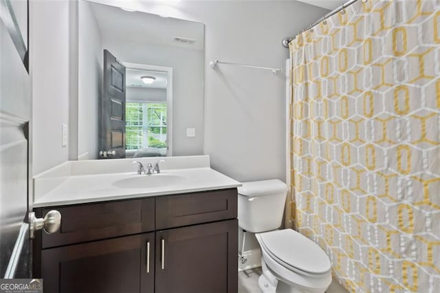 1365 Memorial Dr SE Unit # 12, Atlanta, GA 30317 - bathroom with vanity, toilet, and curtained shower