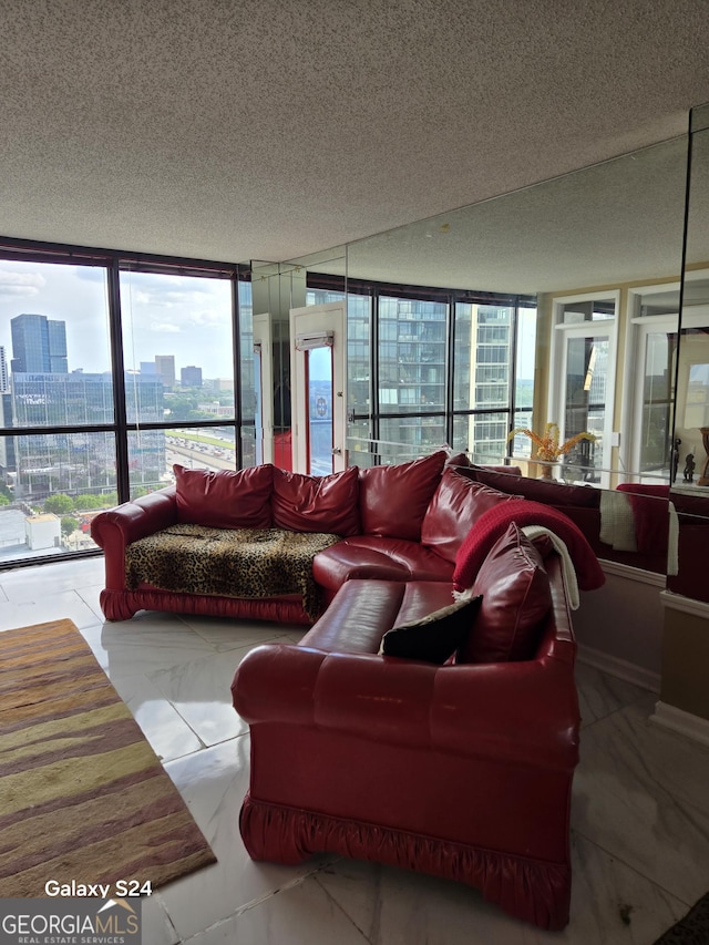 1280 W Peachtree St NW Apt 2606, Atlanta, GA 30309 - living area featuring floor to ceiling windows, a city view, a textured ceiling, and a wealth of natural light