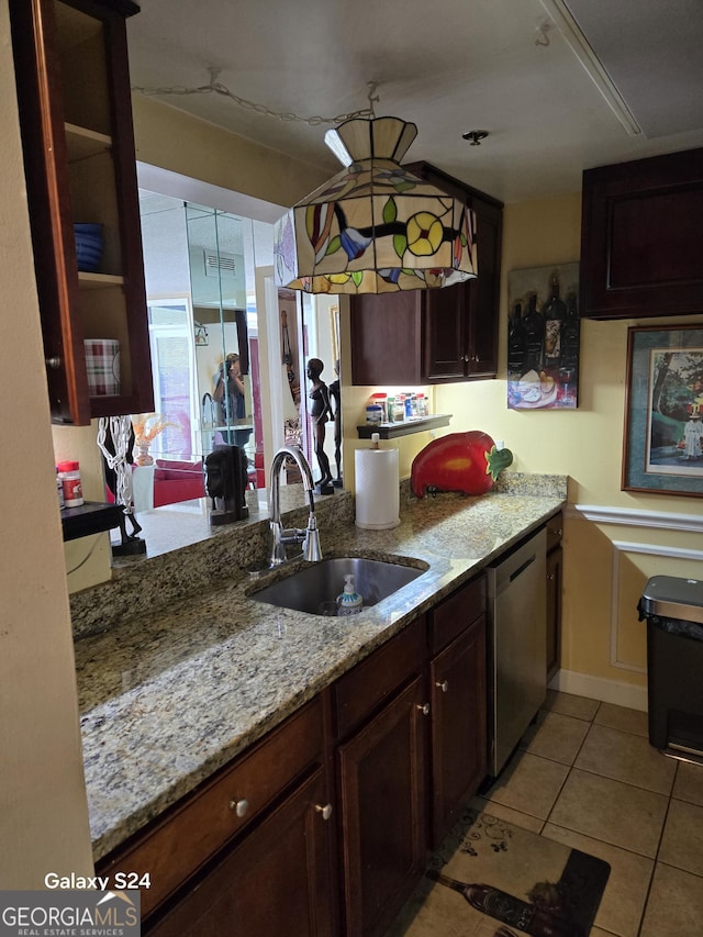 1280 W Peachtree St NW Apt 2606, Atlanta, GA 30309 - kitchen featuring visible vents, light tile patterned flooring, light stone counters, a sink, and dishwasher