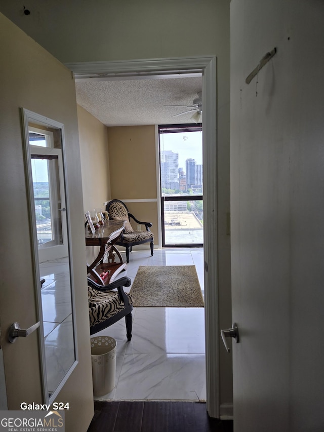 1280 W Peachtree St NW Apt 2606, Atlanta, GA 30309 - hall with a city view and a textured ceiling