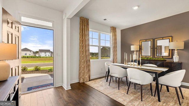 252 Kennelsman Dr, Griffin, GA 30224 - dining area featuring wood-type flooring, baseboards, and visible vents