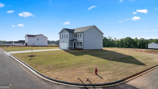 252 Kennelsman Dr, Griffin, GA 30224 - traditional-style home featuring a garage, concrete driveway, and a front lawn