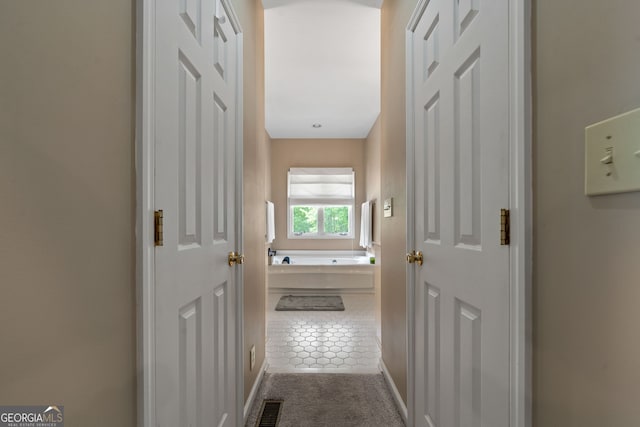 945 Sandy Run Dr, Sparta, GA 31087 - corridor featuring carpet flooring, baseboards, and visible vents