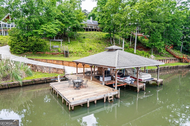 945 Sandy Run Dr, Sparta, GA 31087 - dock featuring boat lift and a water view