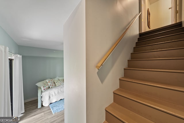 945 Sandy Run Dr, Sparta, GA 31087 - stairway featuring baseboards and wood finished floors