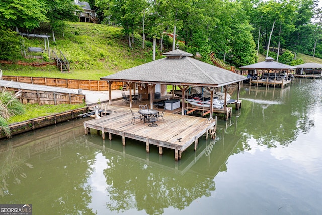 945 Sandy Run Dr, Sparta, GA 31087 - view of dock featuring boat lift and a water view