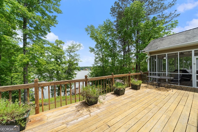 945 Sandy Run Dr, Sparta, GA 31087 - wooden deck featuring a water view, outdoor dining space, and a sunroom