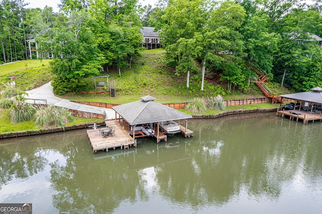 945 Sandy Run Dr, Sparta, GA 31087 - view of dock featuring boat lift and a water view