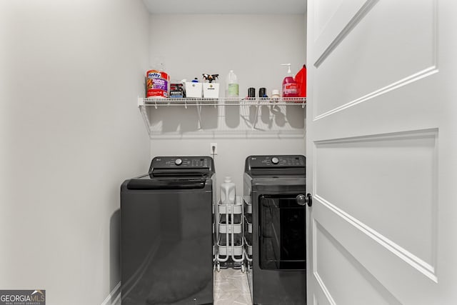 laundry area featuring laundry area and washing machine and clothes dryer