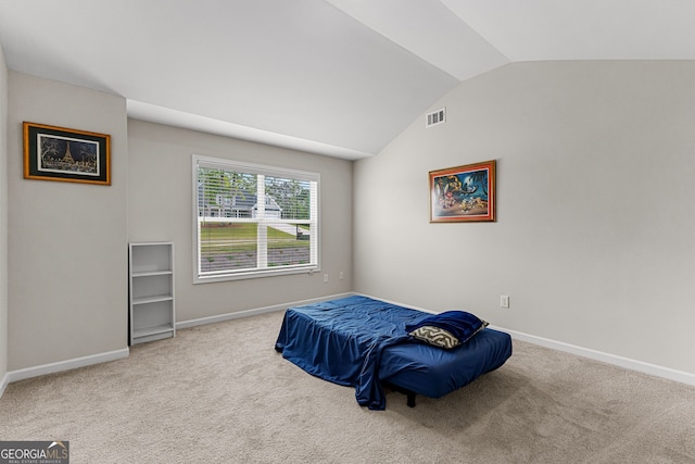 bedroom with baseboards, vaulted ceiling, carpet flooring, and visible vents