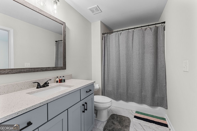 full bath with visible vents, vanity, marble finish floor, toilet, and shower / tub combo