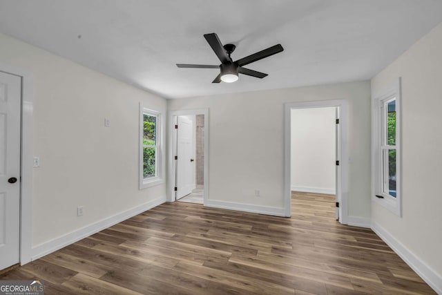 233 Bradshaw Rd, Hiawassee, GA 30546 - spare room with plenty of natural light, wood finished floors, and a ceiling fan