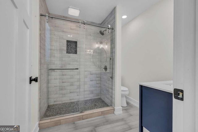 233 Bradshaw Rd, Hiawassee, GA 30546 - bathroom featuring vanity, toilet, baseboards, recessed lighting, and a shower stall