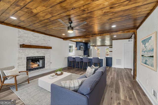 233 Bradshaw Rd, Hiawassee, GA 30546 - living area featuring wooden ceiling, a fireplace, wood finished floors, and visible vents