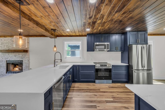 233 Bradshaw Rd, Hiawassee, GA 30546 - kitchen with appliances with stainless steel finishes, a sink, light countertops, light wood-style flooring, and wooden ceiling