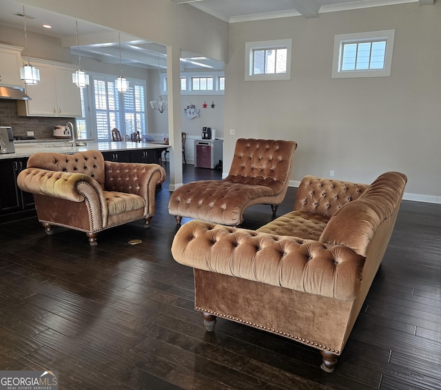 living area featuring recessed lighting, baseboards, ornamental molding, and dark wood-style flooring
