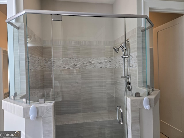 bathroom featuring a shower stall