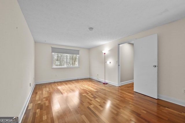 4608 Rosemear Ct, Norcross, GA 30093 - unfurnished room featuring baseboards and light wood-style flooring