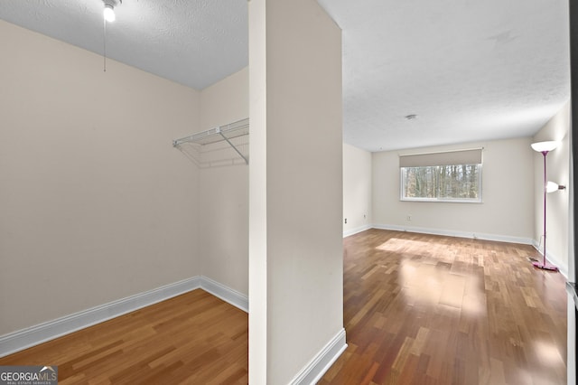 4608 Rosemear Ct, Norcross, GA 30093 - walk in closet with wood finished floors