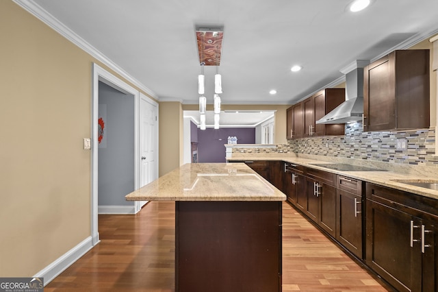 4608 Rosemear Ct, Norcross, GA 30093 - kitchen featuring wall chimney range hood, a center island, ornamental molding, and backsplash