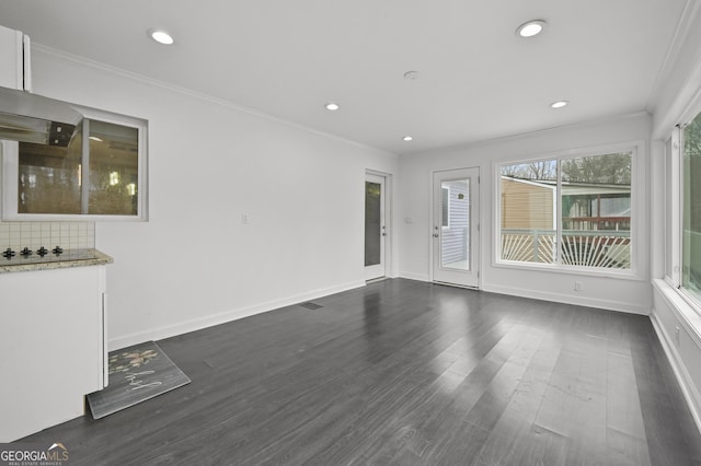 4608 Rosemear Ct, Norcross, GA 30093 - unfurnished living room featuring crown molding, recessed lighting, baseboards, visible vents, and dark wood-style floors