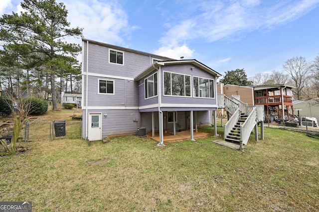 4608 Rosemear Ct, Norcross, GA 30093 - back of property featuring fence, a wooden deck, a sunroom, stairway, and a gate