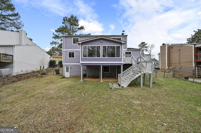 4608 Rosemear Ct, Norcross, GA 30093 - rear view of property featuring fence private yard, a wooden deck, a sunroom, stairs, and a lawn