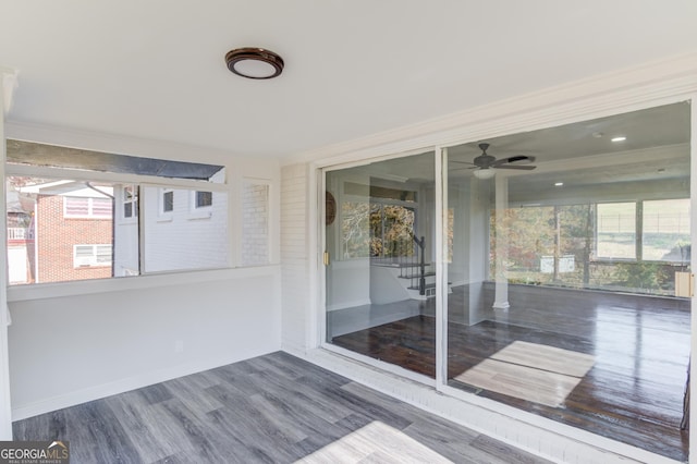 unfurnished sunroom with a wealth of natural light