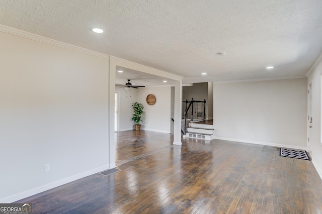 unfurnished living room with recessed lighting, a textured ceiling, and wood finished floors