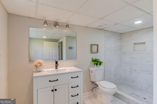 2103 Columbia Dr, Decatur, GA 30032 - below grade area with a paneled ceiling, a wealth of natural light, and baseboards