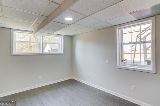 2103 Columbia Dr, Decatur, GA 30032 - finished basement with a drop ceiling, wood finished floors, and baseboards