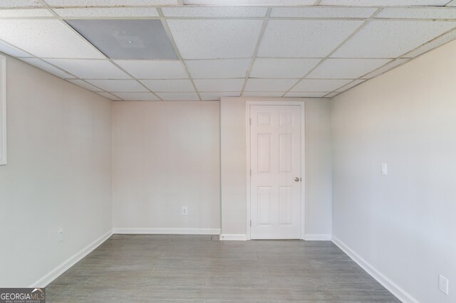 2103 Columbia Dr, Decatur, GA 30032 - empty room with a paneled ceiling, baseboards, and wood finished floors