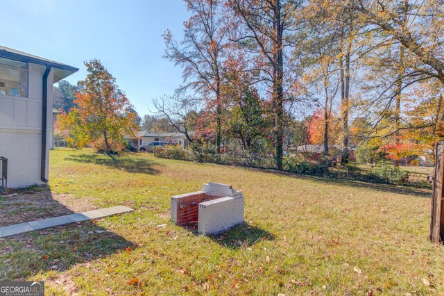 2103 Columbia Dr, Decatur, GA 30032 - view of yard featuring fence, an outdoor structure, and a shed