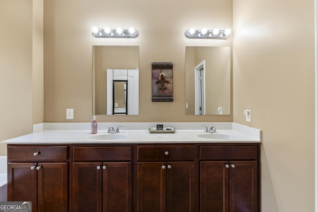 bathroom featuring double vanity and a sink