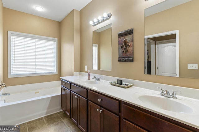 full bathroom featuring a sink, a garden tub, and double vanity
