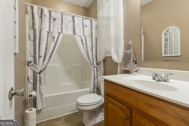 bathroom with vanity, tile patterned flooring, toilet, and shower / tub combo