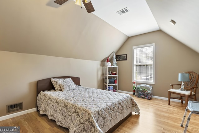 bedroom with visible vents, light wood-style flooring, and baseboards