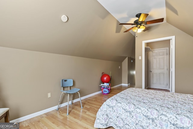 bedroom featuring light wood-type flooring and lofted ceiling