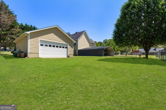 view of side of home with a lawn and a garage
