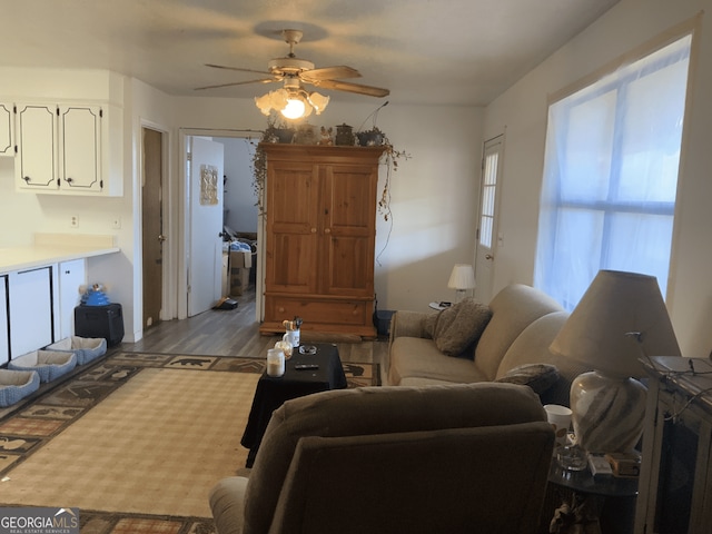 living room featuring ceiling fan and wood finished floors