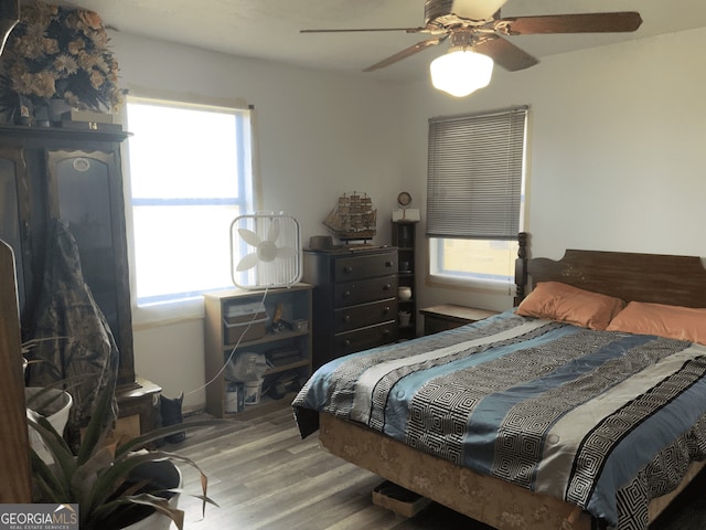 bedroom featuring ceiling fan and wood finished floors