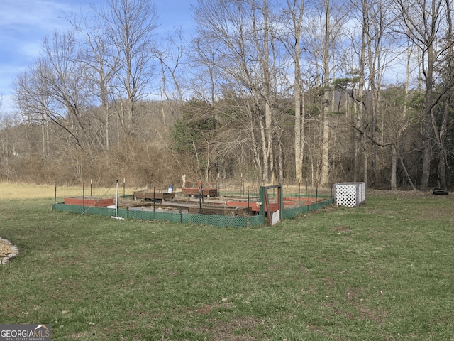 exterior space featuring a yard and a garden