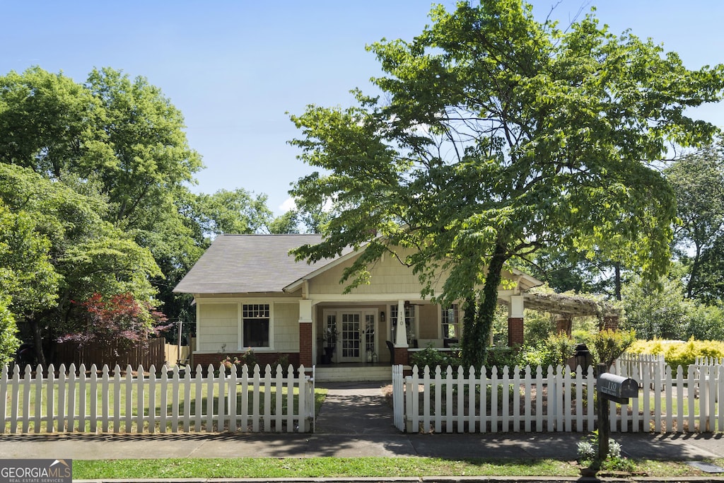 110 S Ave, Cartersville, GA 30120 - view of front facade featuring a fenced front yard and french doors