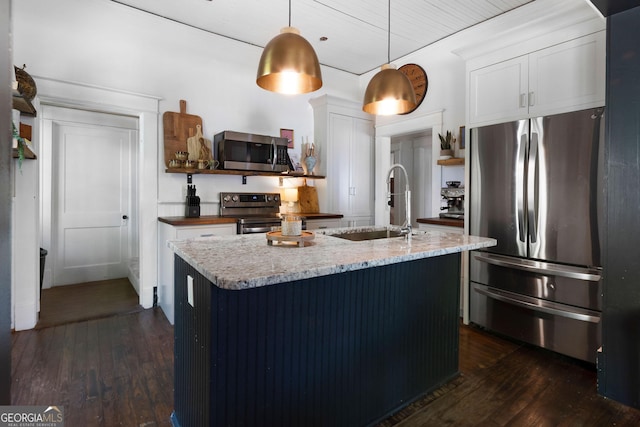 kitchen featuring stainless steel appliances, dark wood-style flooring, a sink, and white cabinetry