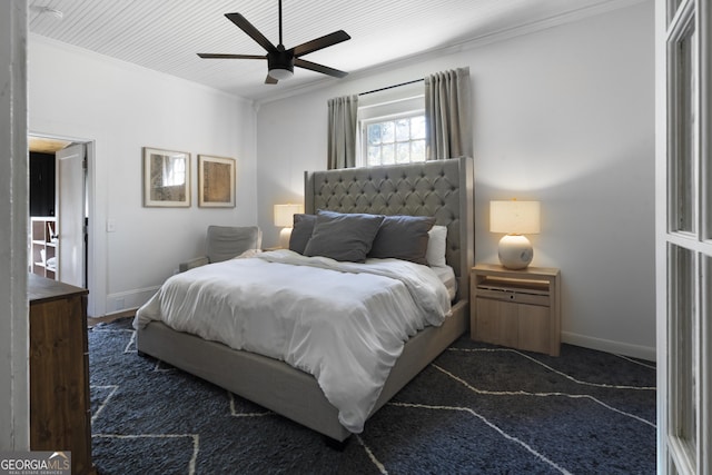 bedroom with ornamental molding, baseboards, and ceiling fan
